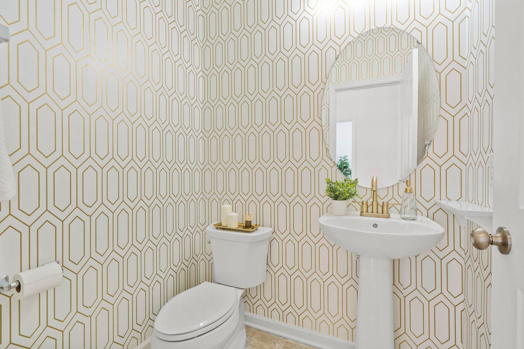 Beautiful main-level bathroom featuring modern finishes, fresh updates, and convenient access for guests and everyday living.