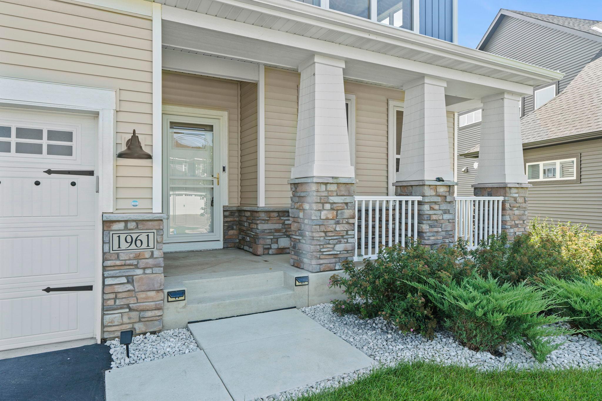 Charming front porch offering a warm, welcoming entry.