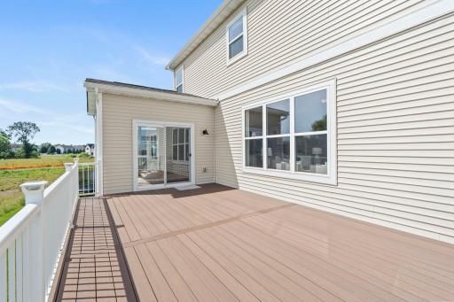 Spacious deck enhanced with charming solar lights, creating a warm, inviting outdoor space perfect for evening relaxation and entertaining.