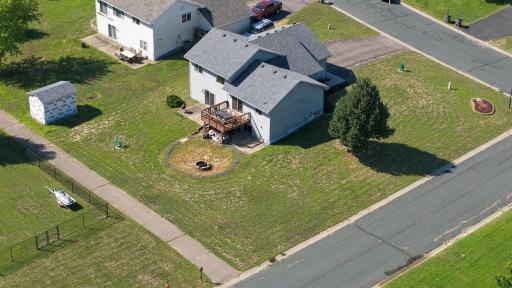 12x12 deck with steps that leads to the backyard