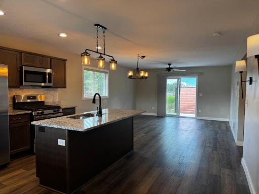 Open-concept kitchen, dining, living room