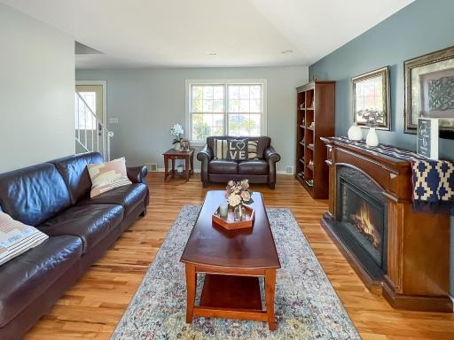 Transition into the inviting family room featuring neutral tones and abundant natural light.