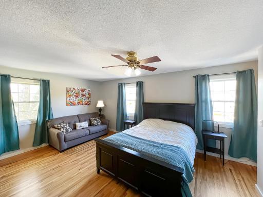An impressive space complete with a ceiling fan for added comfort and multiple windows.