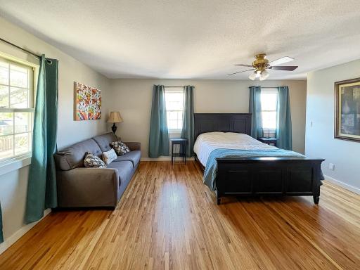 Expansive primary bedroom with plenty of space for a sitting area or additional large furniture.
