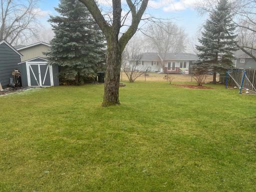 Spacious backyard with mature trees, room to play and plenty of possibilities for outdoor entertaining.