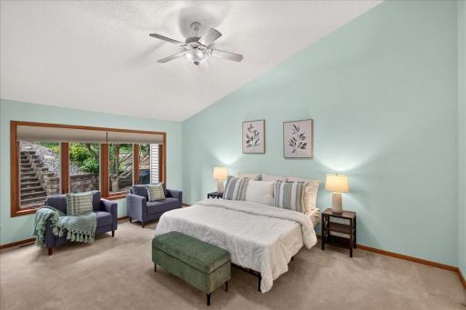 HUGE main level primary bedroom with vaulted ceiling, walk-in closet and large private full bathroom.