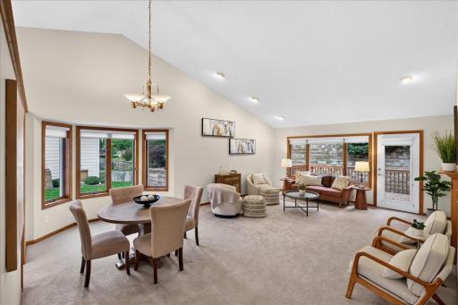 Dining area and living room. The room is HUGE and offers direct access to the deck for summer grilling!