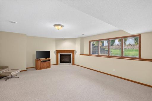 Lower level family room with gas fireplace.