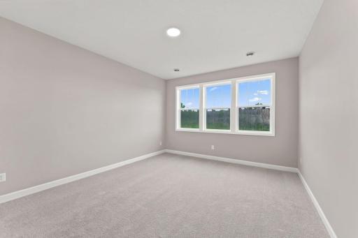 An ownerâs suite sits in a rear corner of the home and is a relaxing oasis with an en-suite bathroom and walk-in closet.