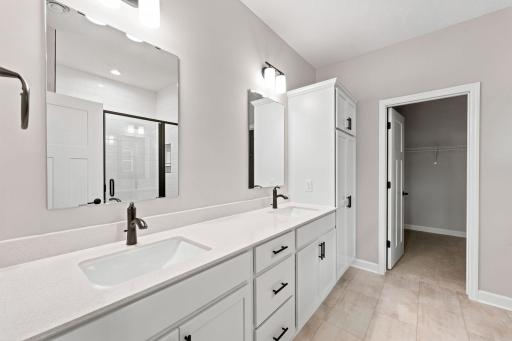 This oversized vanity features optimal dual sinks and twin mirrors to streamline getting-ready routines