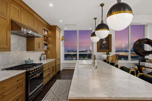 At the center of the kitchen is a 36-inch La Cornue CornuFé dual-fuel range, combining exceptional cooking capability with unmistakable European design.
