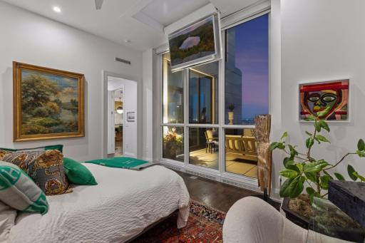 A custom motorized television lift provides seamless access to entertainment while keeping the room visually clean and sophisticated.