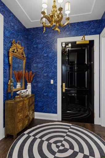 The entry immediately sets the tone with a custom Ryan Companies racetrack ceiling detail, designer lighting and carefully integrated architectural illumination.