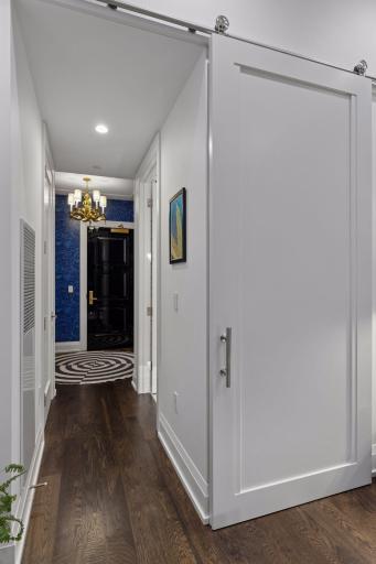 The owner's closet was professionally designed by Twin Cities Closet Company with custom storage, extensive valet rods and integrated LED lighting.