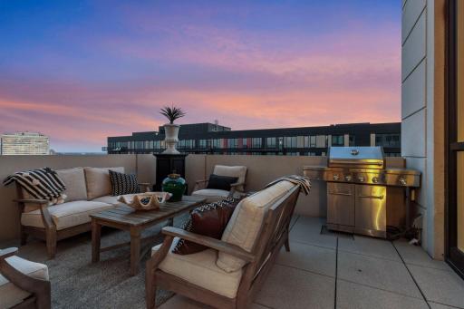 The private terrace includes a KitchenAid grill connected to the home's gas line, eliminating the need for propane tanks.