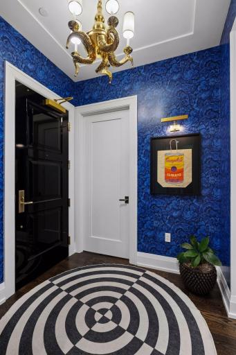 Dedicated art lighting was added throughout the entry, creating gallery-style opportunities to showcase a personal collection.
