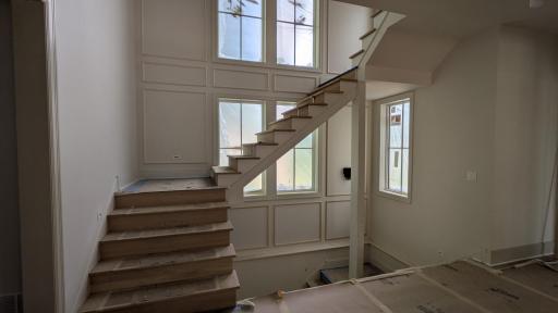 Main floor stair case waiting on railing
