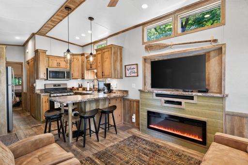 Warm, inviting, and thoughtfully designed, this cozy living room and open kitchen setup brings charm together with sleek modern comfort. Speaking of comfort , this queen sleep sofa is perfect.