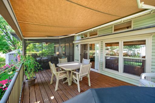 A spacious 38x12 deck serves as the centerpiece for outdoor entertainment, seamlessly blending open-air patio space with protected shade.