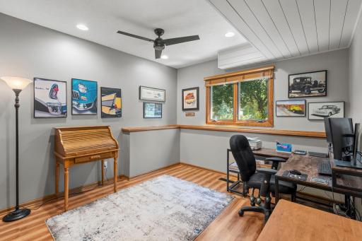 This flexible lower level room is ideal for a home office, creative studio, music room or hobby space.