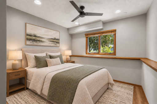 Virtually staged to show its potential, this lower level bedroom offers a comfortable and private space for overnight guests.