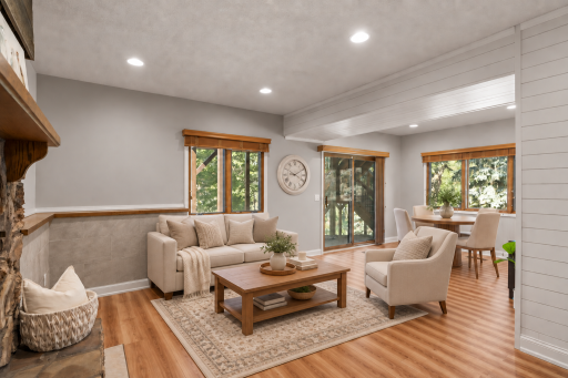 Virtually staged to show the possibilities, the walkout lower level offers plenty of room for relaxing, entertaining and enjoying game nights near the patio door.