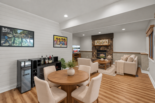 Virtually staged to highlight the spacious layout, the lower level family room is centered around a second wood burning fireplace with room for conversation and games.