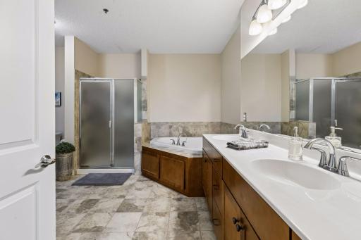 Spacious and well-appointed with a double vanity, separate shower, jetted tub, private toilet area, and plenty of room to move comfortably.