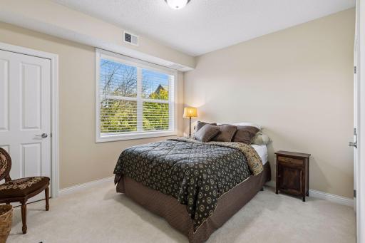 2nd bedroom with nice sized closed and views of nature