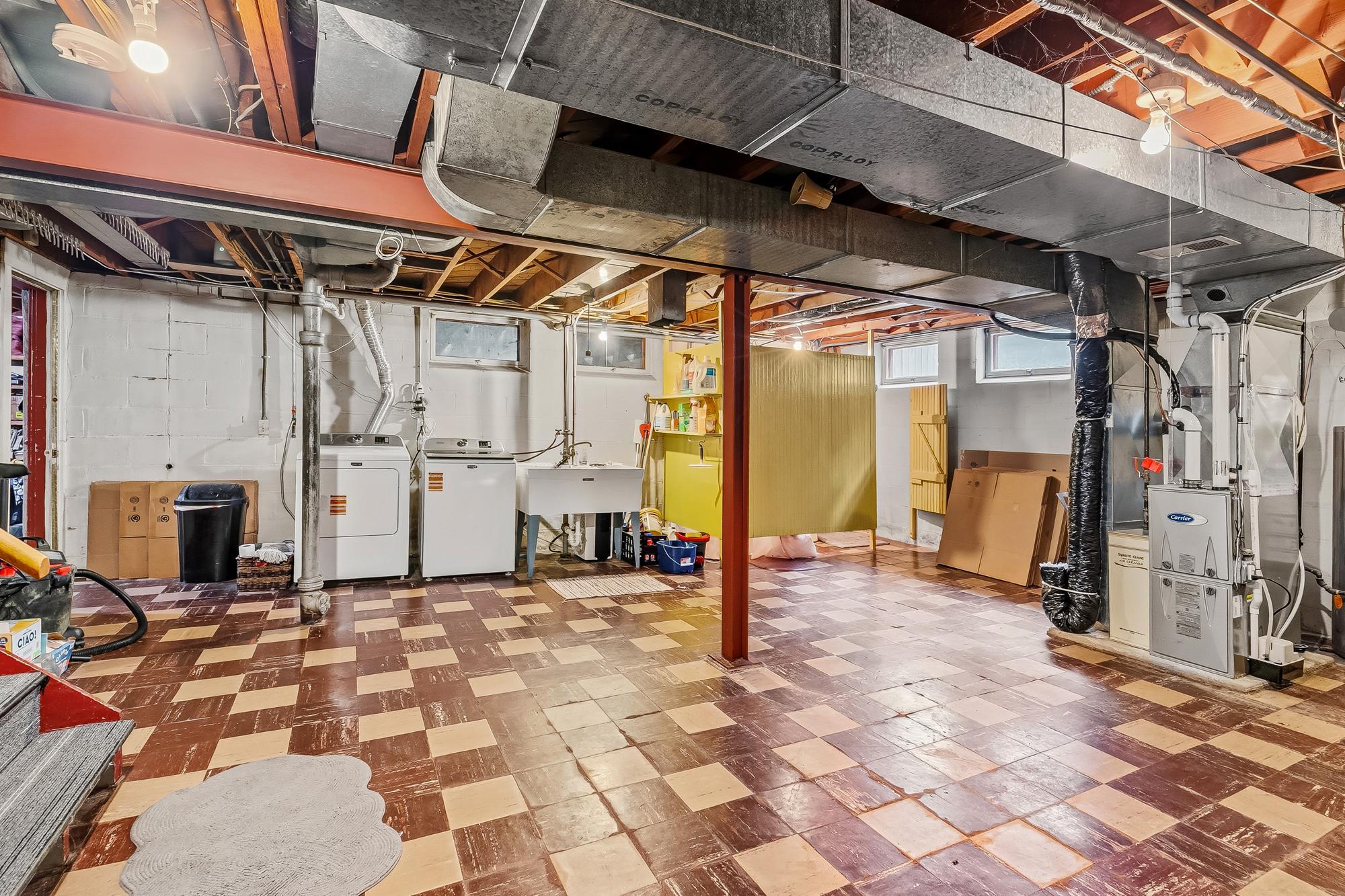 Unfinished lower level full of possibilities