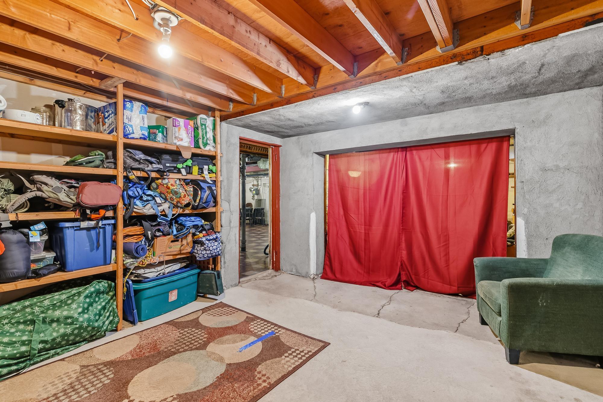 Another view of storage space between laundry and attached garage