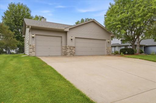 The extra-wide driveway leads to a spacious heated and insulated garage, ideal for Minnesota winters while providing comfortable space for vehicles, storage, hobbies, and projects year-round.