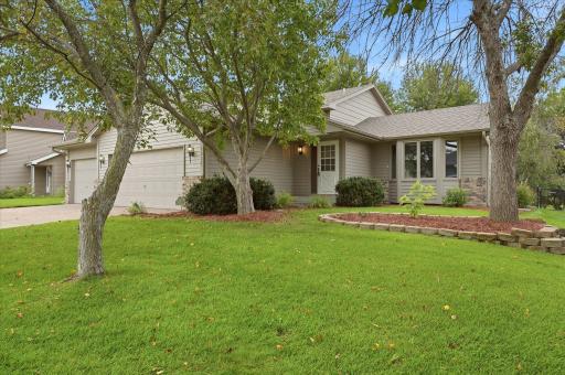 Thoughtfully maintained exterior surrounded by professional landscaping, with an irrigation system helping keep the lawn and landscaping looking their best throughout the season.