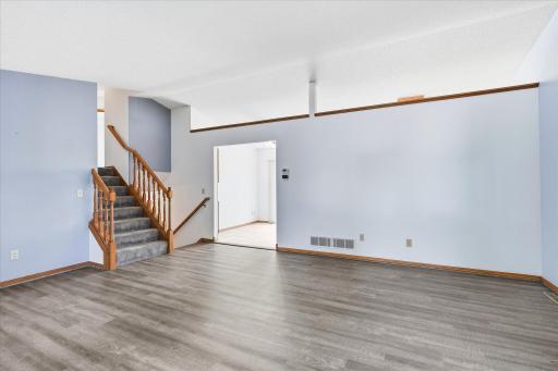 An open layout creates an easy transition from the living room into the kitchen and dining areas.