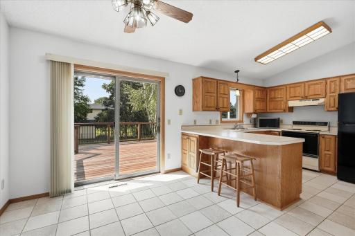 Comfortable dining area positioned just off the kitchen with direct access to the backyard deck for easy indoor-outdoor entertaining. Updated Anderson windows and sliding glass doors throughout the home.