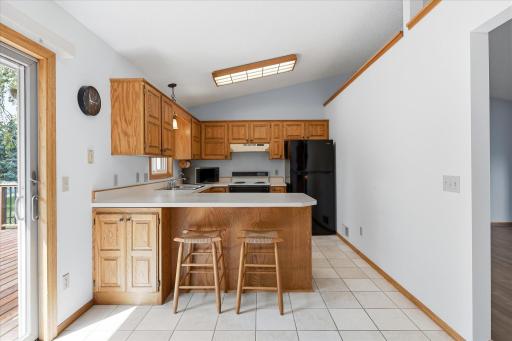 The convenient breakfast bar provides additional prep space and seating while keeping the kitchen open to the surrounding living areas.