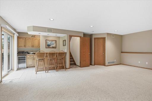 The generous layout offers plenty of flexibility for multiple seating areas, a game space, and entertaining.