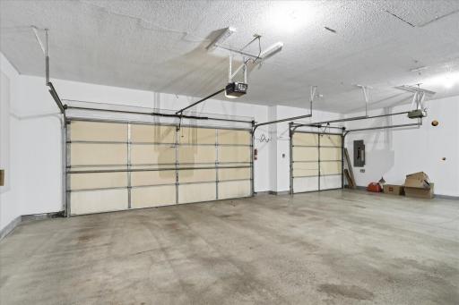 Fully finished, insulated, and heated garage with insulated garage doors offers a comfortable, functional space for vehicles, hobbies, and projects throughout the year.
