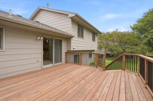 The combination of an upper-level cedar deck and lower-level patio provides multiple outdoor living spaces to enjoy.