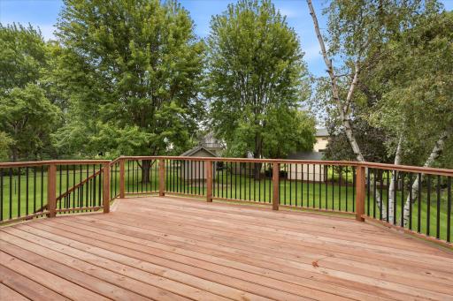 New cedar tone treated deck (2025) provides a beautiful outdoor extension of the kitchen and an ideal spot for grilling, dining, or relaxing.