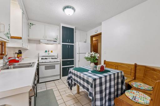 The eat-in kitchen offers plenty of storage and room for casual dining, with an opportunity to reimagine the space to suit your style.