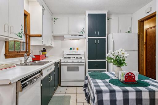 A cozy eat-in kitchen offers plenty of cabinet storage and room for a small table, with an opportunity to update and make the space your own.