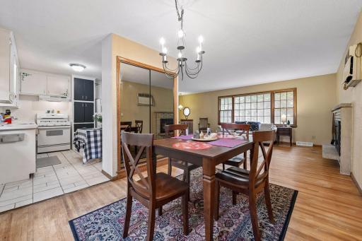 The dining area sits between the kitchen and living room, highlighting the easy flow of the main level and abundant natural light.