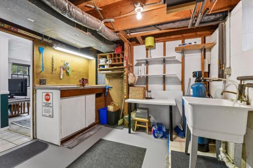 Even the utility room is impressively organized, with a dedicated workbench, utility sink and abundant project and storage space.
