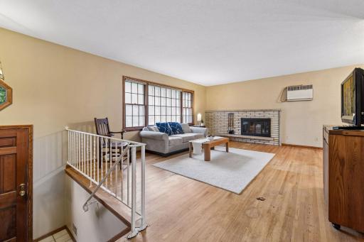 The split-entry design opens to a spacious main-level living area, with an easy flow into the adjoining dining room.