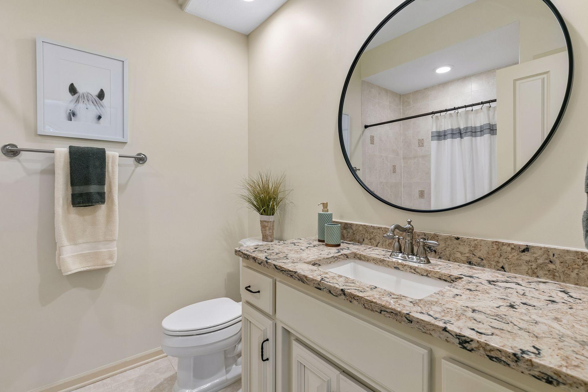 Full upper level ensuite bathroom with granite top
