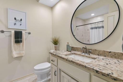 Full upper level ensuite bathroom with granite top