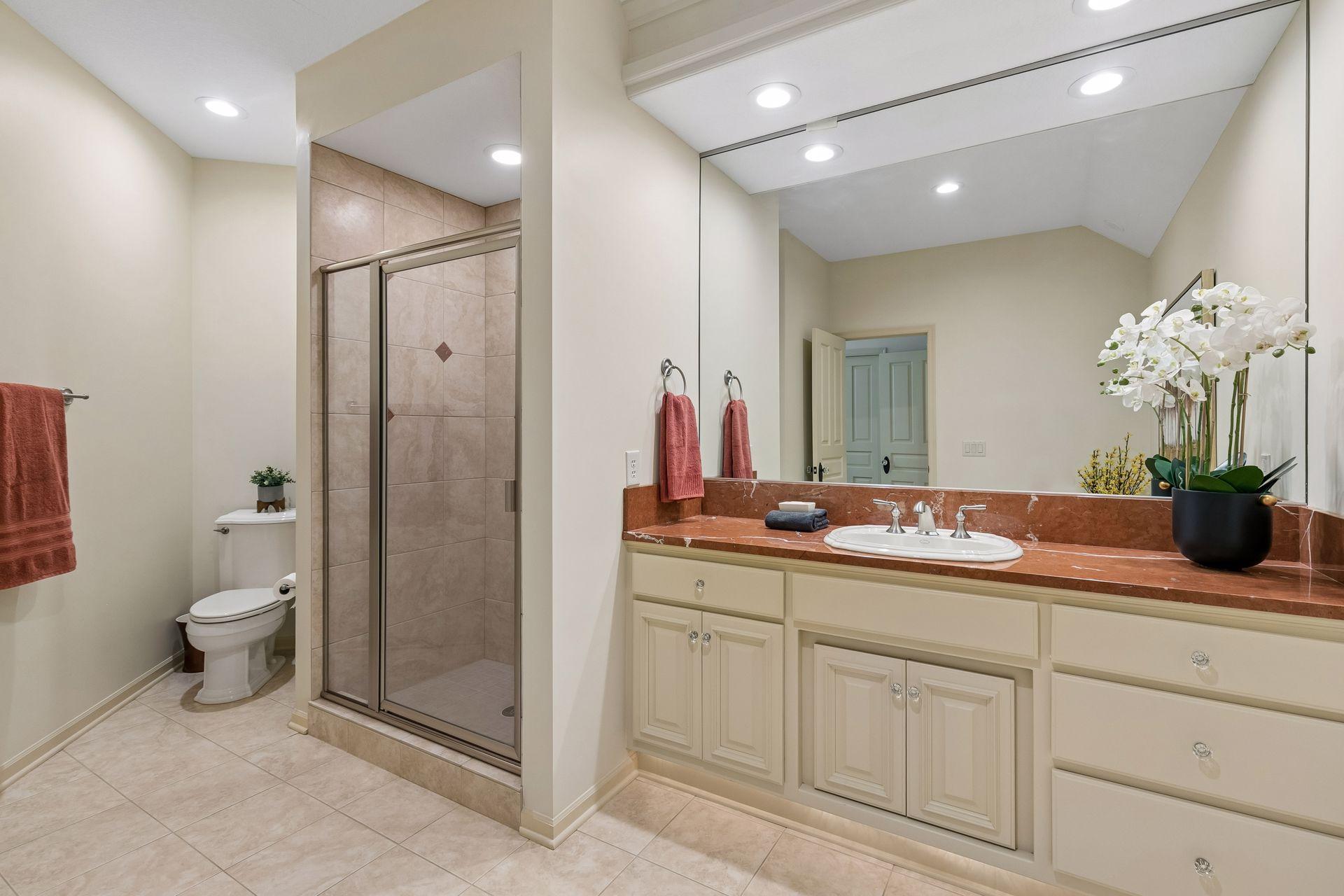 3/4 Third bedroom ensuite with granite tops, tile shower and floors.