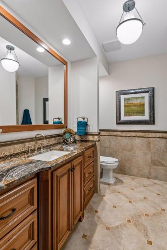 Lower level 3/4 bathroom with granite top and in-floor heat