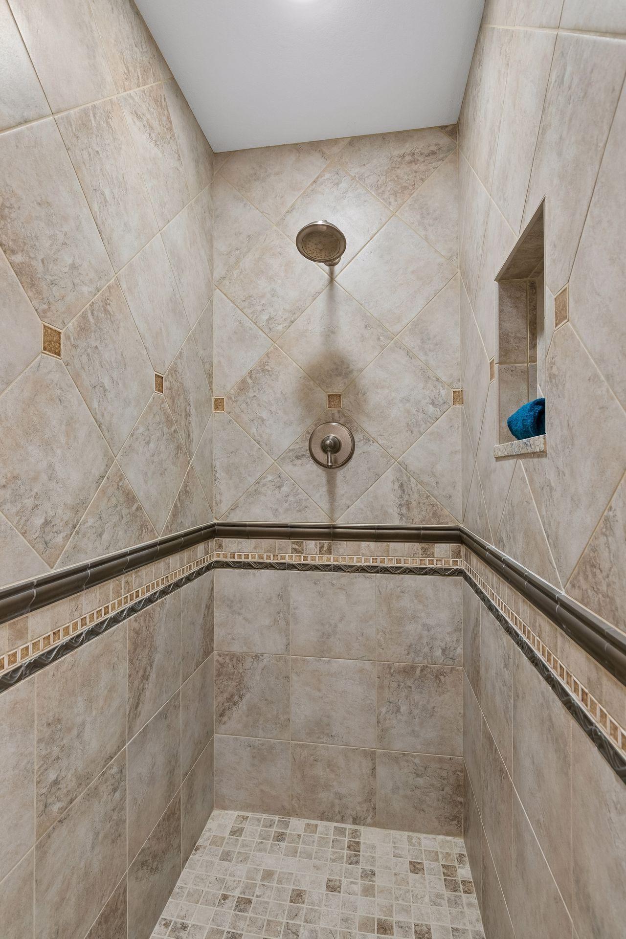 Walk-in custom tile shower in 3/4 bath